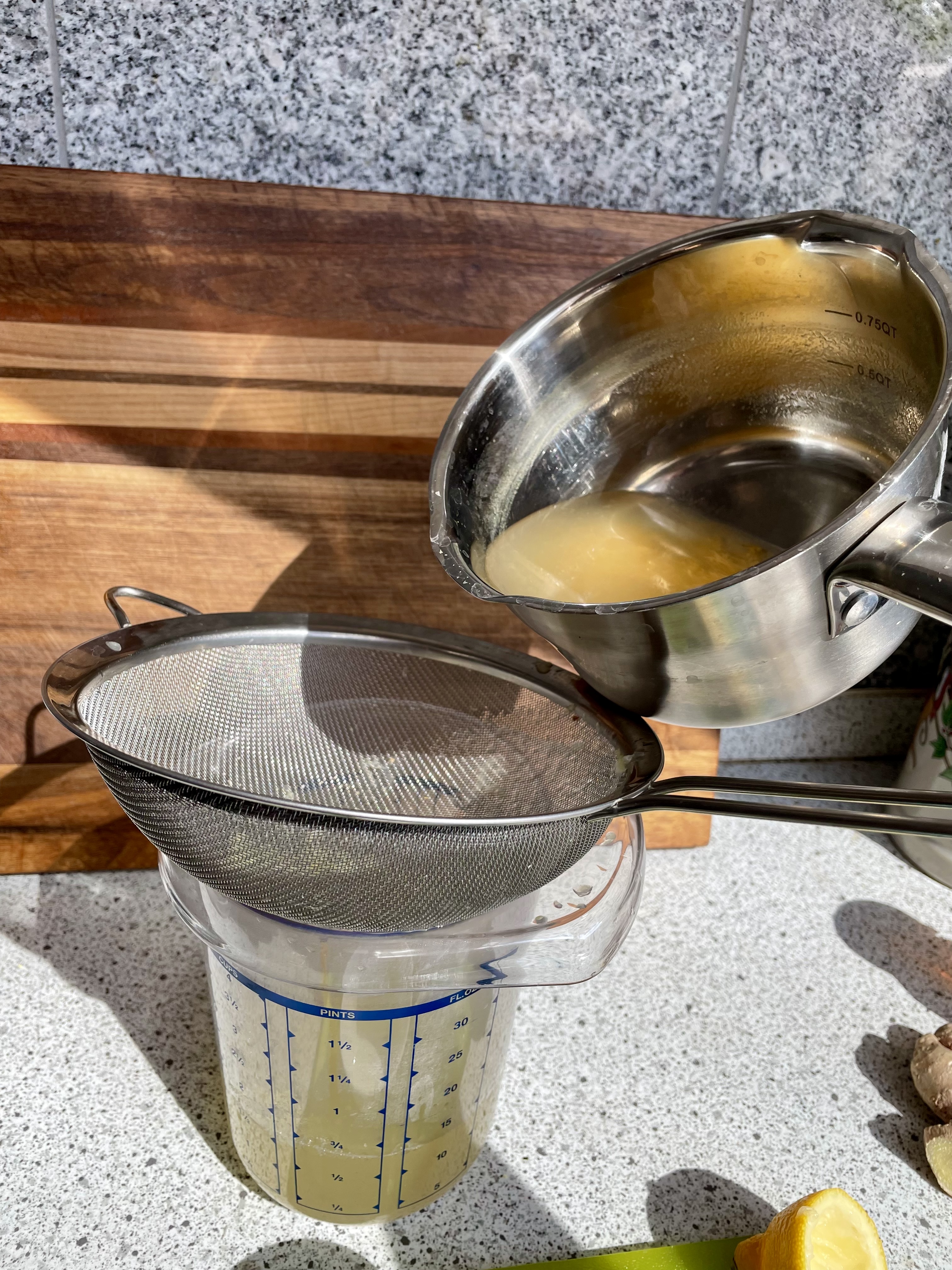 pouring ginger juice gluten free grubz